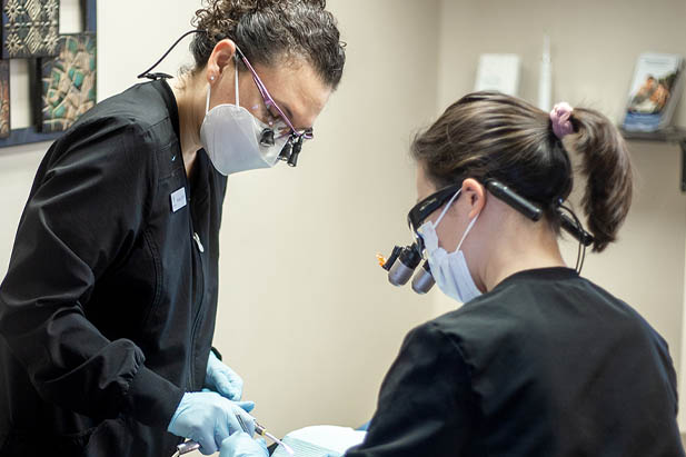 Renew Family Dentistry dentists performing treatments