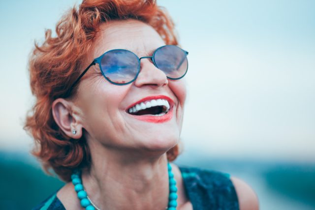 woman smiling after her dental treatment